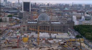 Link to Photo | dome, Reichstag building, Germany, screenshot, 1999, color, 35 mm film, high-angle shot, historic building, construction site, 2K resolution, aerial shot, capital city, tourist attraction, photographic film, Berlin, architectural structure, Berlin Babylon