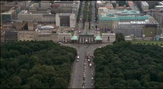 Link to Photo | tourist destination, big city, Germany, screenshot, color, 35 mm film, high-angle shot, 2K resolution, aerial shot, capital city, daytime, tourist attraction, photographic film, Berlin, Berlin Babylon, Brandenburg Gate