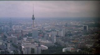 Link to Photo | establishing shot, Fernsehturm Berlin, big city, Mitte, Germany, metropolis, Mitte, screenshot, 1998, color, 35 mm film, wide shot, panorama, cityscape, 2K resolution, aerial shot, capital city, photographic film, Berlin, Berlin Babylon, cloud cover