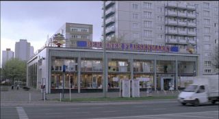 Link to Photo | architecture, Mitte, German Democratic Republic, Germany, screenshot, color, 35 mm film, road, 1990s, building, 2K resolution, capital city, East Berlin, photographic film, Berlin, Karl-Marx-Allee, Berlin Babylon
