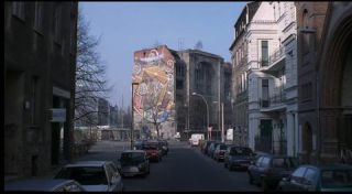Link to Photo | March, spring, big city, graffiti, Germany, façade, Mitte, screenshot, 1998, color, 35 mm film, point-of-view shot, historic building, 2K resolution, capital city, Kunsthaus Tacheles, photographic film, Berlin, Oranienburger Straße, Auguststraße, Berlin Babylon, driving