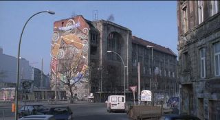 Link to Photo | March, spring, big city, graffiti, Germany, façade, Mitte, screenshot, 1998, color, 35 mm film, point-of-view shot, historic building, 2K resolution, capital city, Kunsthaus Tacheles, photographic film, Berlin, Oranienburger Straße, Auguststraße, Berlin Babylon, driving