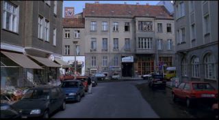 Link to Photo | passenger car, motor car, Mitte, Germany, Marienstraße, Mitte, 1990, screenshot, color, 35 mm film, point-of-view shot, Parken Stadium, 1990s, capital city, photographic film, Berlin, Berlin Babylon, driving