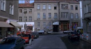 Link to Photo | passenger car, motor car, Mitte, Germany, Marienstraße, Mitte, 1990, screenshot, color, 35 mm film, point-of-view shot, Parken Stadium, 1990s, capital city, photographic film, Berlin, Berlin Babylon, driving