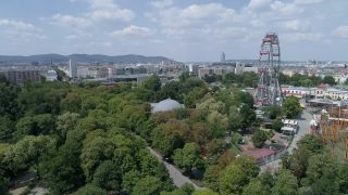 Link to Video | footage, big city, million city, Vienna, Federal State of Austria, amusement park, metropolis, Kaiserwiese, 4K resolution, 2019, federal capital, traveling carnival, Innere Stadt, Western Europe, Leopoldstadt, Wurstelprater, Austria, Europe, aerial shot, capital city, Ferris Wheel in Vienna