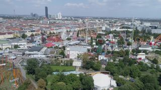 Link to Video | footage, big city, million city, Vienna, Federal State of Austria, amusement park, metropolis, Kaiserwiese, 4K resolution, 2019, federal capital, traveling carnival, Innere Stadt, Western Europe, Leopoldstadt, Wurstelprater, Austria, Europe, aerial shot, capital city, Ferris Wheel in Vienna