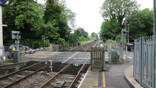 Link to Video | footage, United Kingdom, track, waiting, level crossing, Full High Definition, England, color, Great Britain, 2016, road, rail transport, daytime, boom barrier