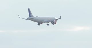 Link to Video | approach, slow motion, airplane, airliner, undercarriage, sky, landing