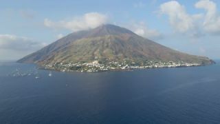 Link to Video | Stromboli, color, 4K resolution, Italy, aerial shot, Mediterranean Sea, volcano
