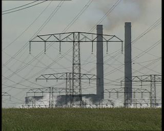 Link to Video | high voltage, electricity, fossil fuel, smoke, air pollution, Lübbenau/Spreewald, German Democratic Republic, chimney, power cable, 1990, color, standard-definition television, 1990s, greenhouse effect, sky, coal-fired power station, Betacam SP, transmission tower, eastern Germany