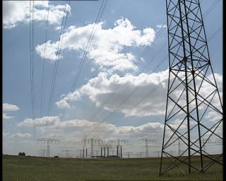 Link to Video | high voltage, electricity, fossil fuel, smoke, air pollution, Lübbenau/Spreewald, German Democratic Republic, chimney, power cable, 1990, color, standard-definition television, 1990s, greenhouse effect, sky, coal-fired power station, Betacam SP, transmission tower, eastern Germany