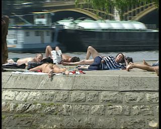 Link to Video | tourist destination, France, megacity, resting, metropolis, 1991, color, lying, standard-definition television, 90s, 1990s, river, Europe, sun bathing, megalopolis, Betacam SP, Paris