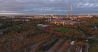 Link to Video | October, autumn, Olympic Stadium of Munich, big city, Munich, 2020, wide shot, Olympiapark, horizon, aerial shot, sky, tourist attraction, evening, cloud cover, Bavaria
