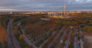 Link to Video | October, autumn, Olympic Stadium of Munich, big city, Munich, 2020, wide shot, Olympiapark, horizon, aerial shot, sky, tourist attraction, evening, cloud cover, Bavaria