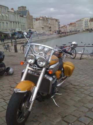 Link to Photo | cruiser, photograph, France, 2009, amateur photography, color, Vieux-Port de La Rochelle, Charente-Maritime, motorcycle, golden yellow, port, hobby, city, La Rochelle, Triumph Rocket 3, Triumph Rocket III, luxury good