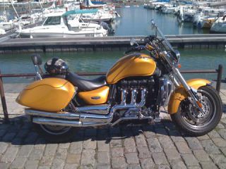 Link to Photo | cruiser, photograph, France, 2009, amateur photography, color, Vieux-Port de La Rochelle, Charente-Maritime, motorcycle, golden yellow, port, hobby, city, La Rochelle, Triumph Rocket 3, Triumph Rocket III, luxury good