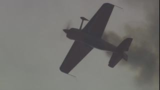 Link to Video | airplane with propellers, air show, smoke, show, recurring event, Full High Definition, acrobatics, airplane, 2009, sound on tape, flight, low-angle shot, color, spectacle, aerobatic maneuver, AERO Friedrichshafen, Europe, sky, trade fair, aviation